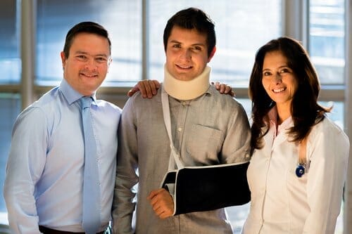 man in neck brace with family